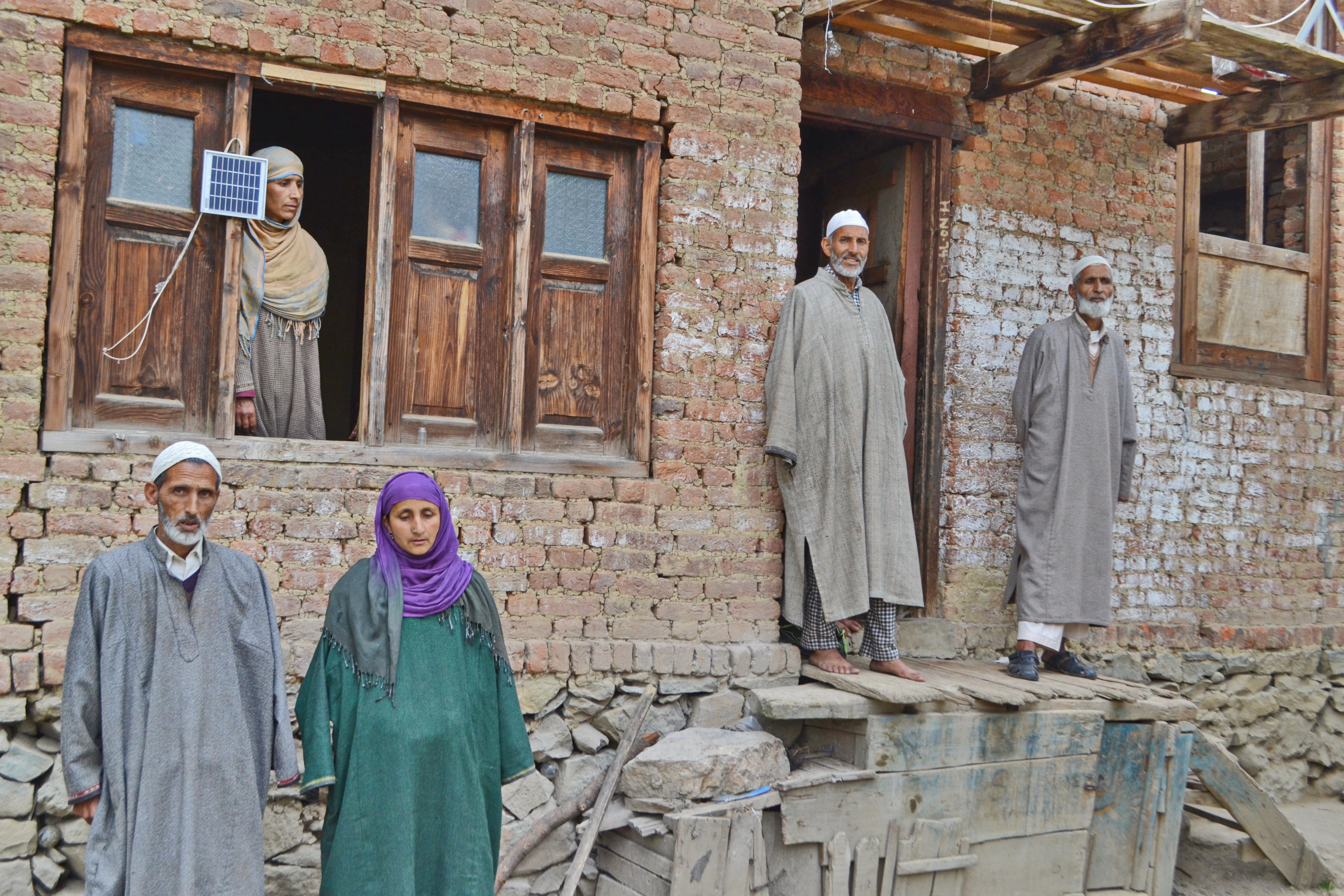 A fallen son and an endless wait: Relatives of Jahangir Wani, a sand digger. Jahangir was walking in an alley of a neighbourhood village when the forces shot him to death