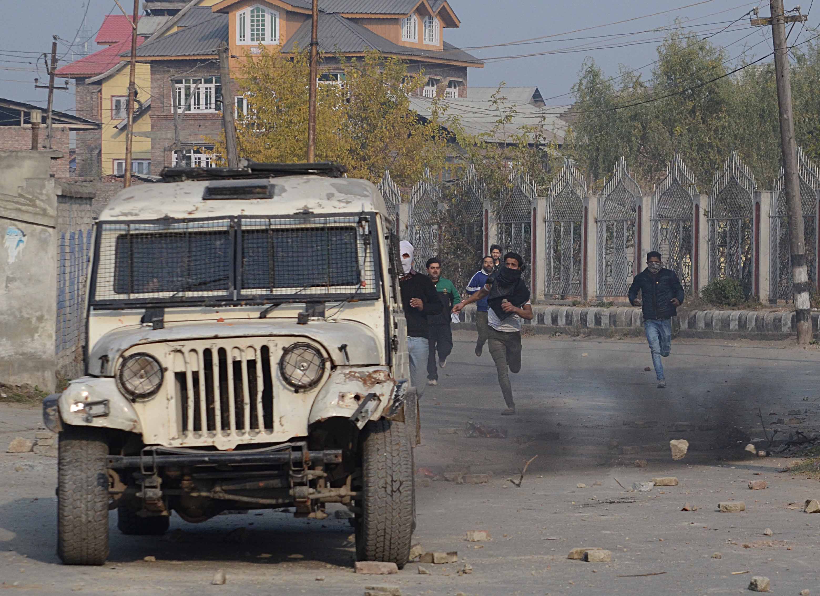 Protestors resorted to stone-pelting after police tear-gassed the funeral of Shalimar teenager. Photo: Faisal Khan 