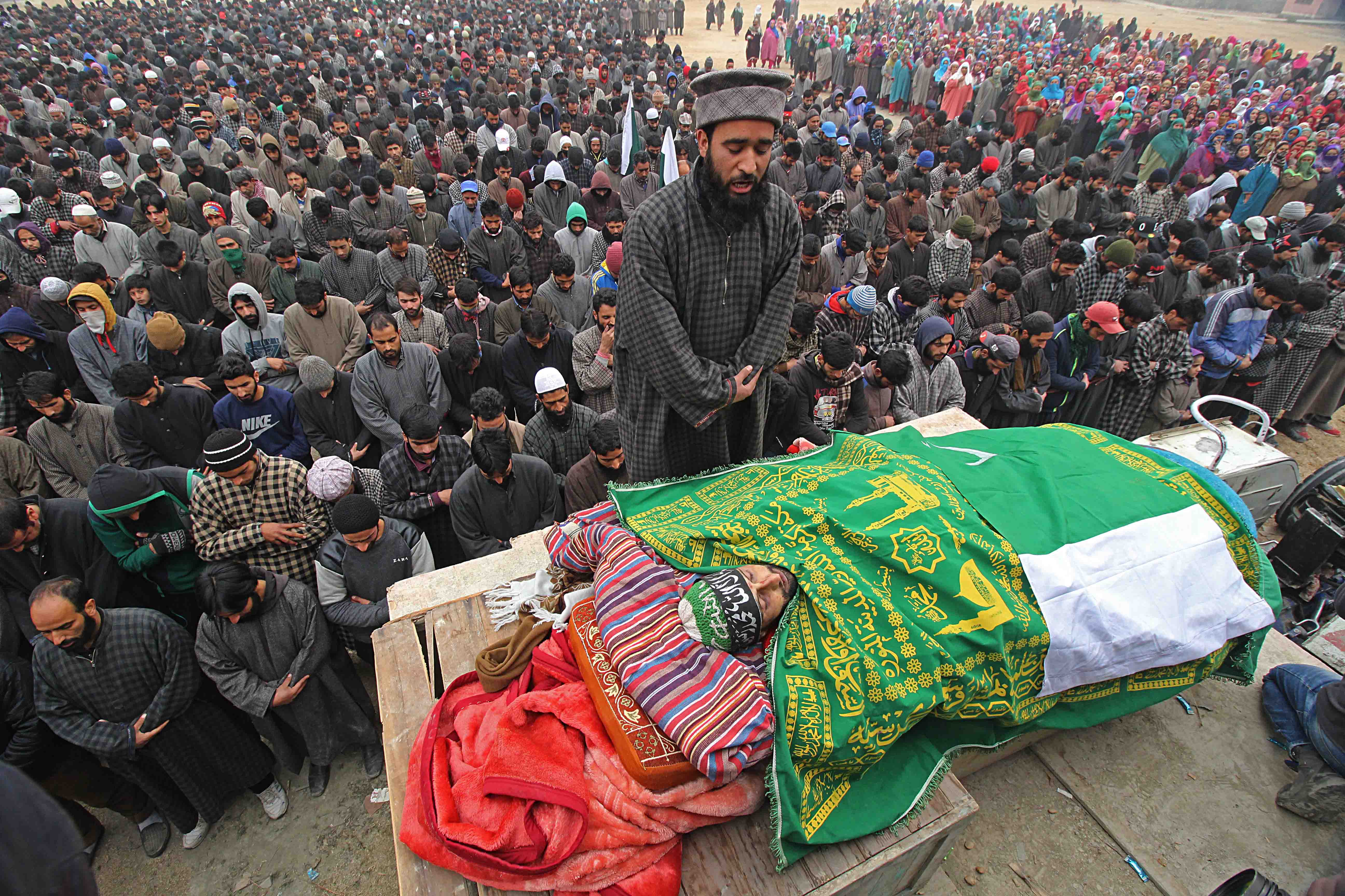 People offer funeral prayers over the slain militant Rayees Ahmad Dar in Kakapora, Pulwama on Sunday. 